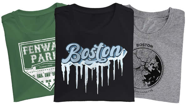 A display of three Boston-themed t-shirts: a green 'Fenway Park' field layout, a black with dripping 'Boston' text, and a heather grey featuring a map of Boston, Massachusetts.