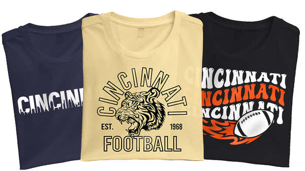 A selection of Cincinnati-themed t-shirts showcasing city pride with vibrant designs and football motifs.