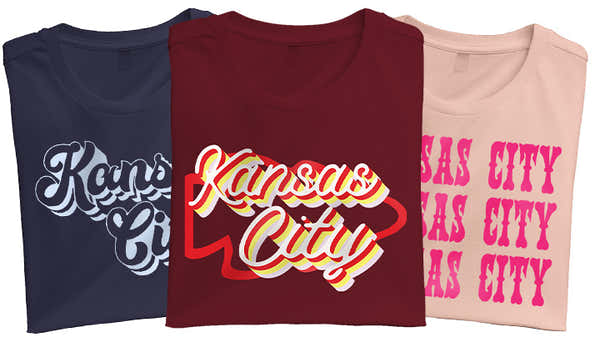 A set of Kansas City-inspired t-shirts in navy, maroon, and beige, featuring artistic and cursive lettering designs.