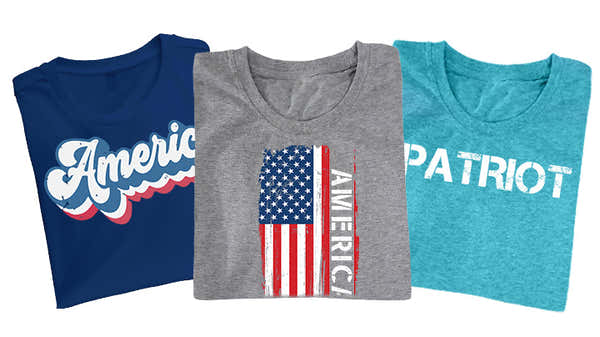 Banner featuring three patriotic-themed t-shirts: navy with 'America' in cursive script, gray with a distressed American flag, and turquoise with 'PATRIOT' in bold text.