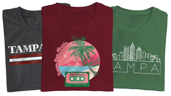 Assorted Tampa Bay t-shirts in gray, red, and green, featuring designs with the city's name, a vibrant palm tree sunset, and a cityscape outline.